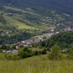 a view of a small village in the mountains